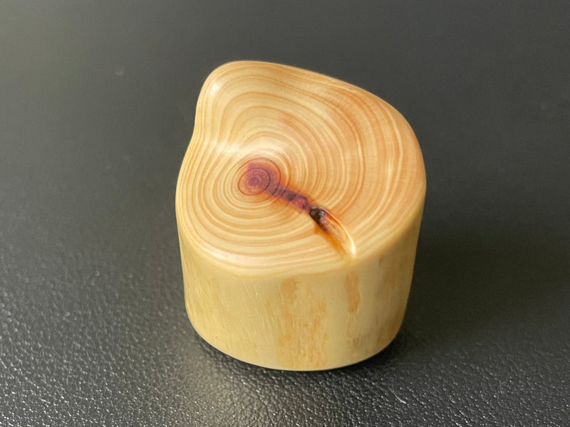 Whisper Channel cedar flow fidget with thumb-guiding channel